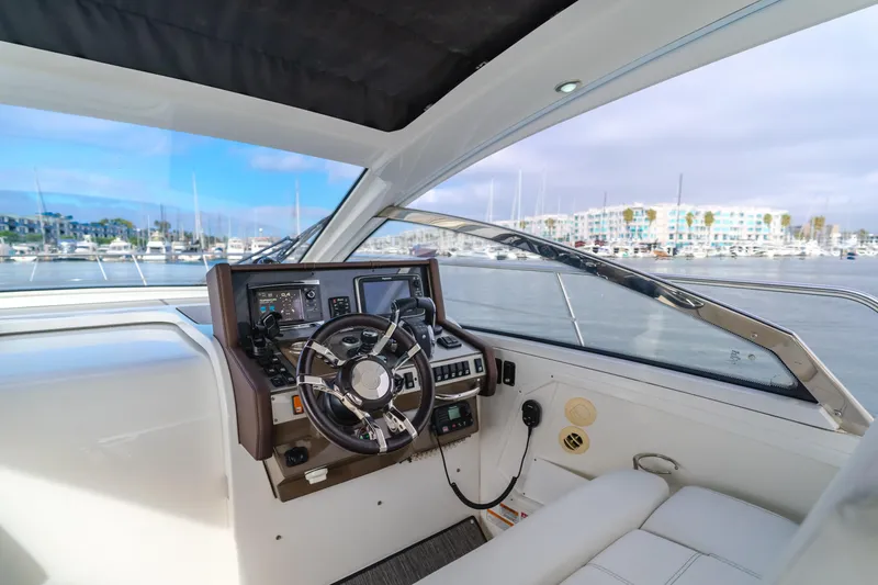 Lux Life Yacht Photos Pics 2017 Cruisers Yachts 39 Express Coupe helm with marina view.