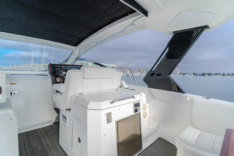 Lux Life Yacht Photos Pics 2017 Cruisers Yachts 39 Express Coupe interior with helm, seating, and water view.