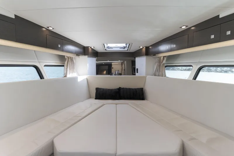 Lux Life Yacht Photos Pics Luxurious interior of 2017 Cruisers Yachts 39 Express Coupe with elegant seating and windows.