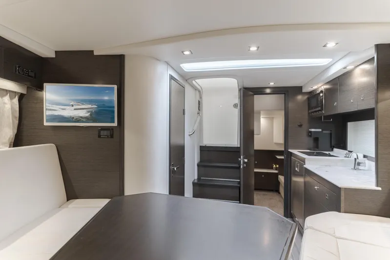 Lux Life Yacht Photos Pics Luxurious interior of 2017 Cruisers Yachts 39 Express Coupe with modern amenities.