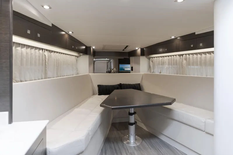 Lux Life Yacht Photos Pics 2017 Cruisers Yachts 39 Express Coupe interior with modern seating and table.