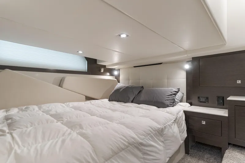 Lux Life Yacht Photos Pics Luxurious cabin interior of 2017 Cruisers Yachts 39 Express Coupe with cozy bedding.
