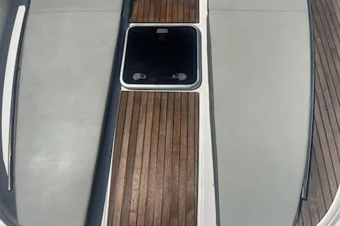  Yacht Photos Pics 2019 Jeanneau 9.0 WA boat deck with wood and gray seating.