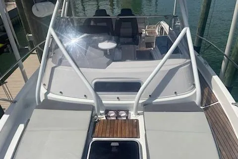  Yacht Photos Pics 2019 Jeanneau 9.0 WA boat with spacious deck and seating area, docked at marina.