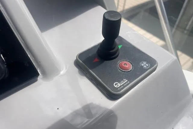  Yacht Photos Pics Joystick control on a 2019 Jeanneau 9.0 WA boat dashboard.