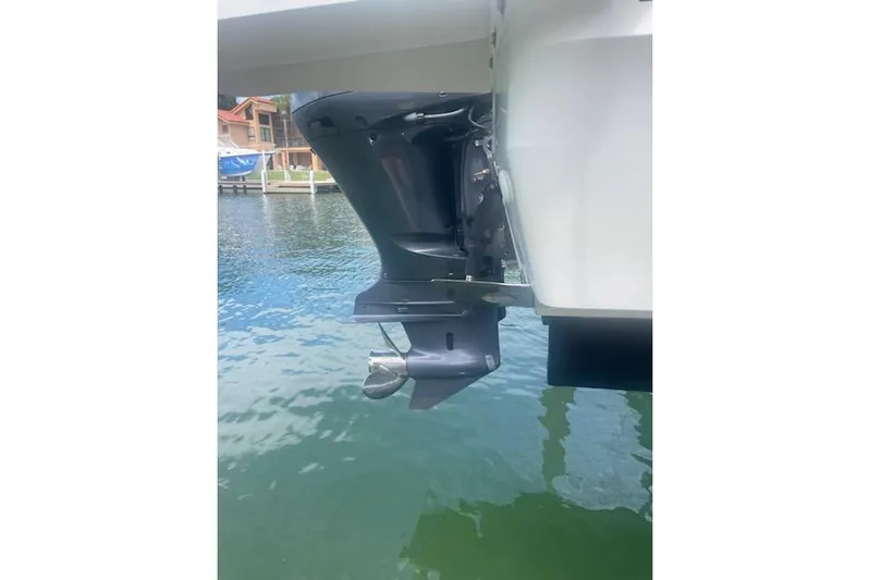  Yacht Photos Pics Outboard motor of a 2019 Jeanneau 9.0 WA boat on water.