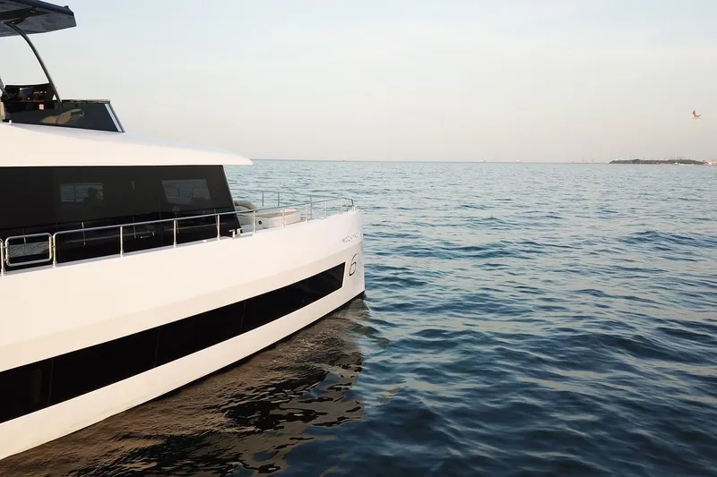  Yacht Photos Pics Luxury Moon Yachts 6ty 2026 model cruising on calm ocean waters.