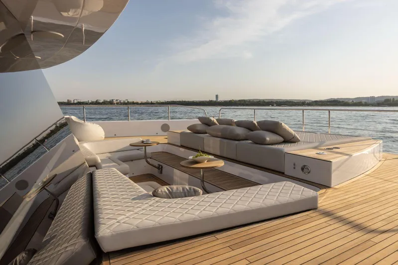  Yacht Photos Pics Luxurious deck of 2026 Moon Yachts 6ty with elegant seating and ocean view.