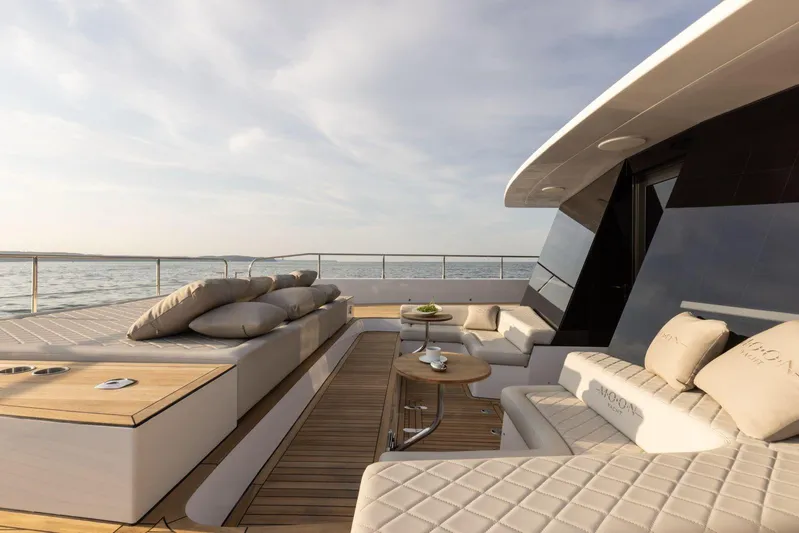  Yacht Photos Pics Luxurious 2026 Moon Yachts 6ty deck with elegant seating and ocean view.