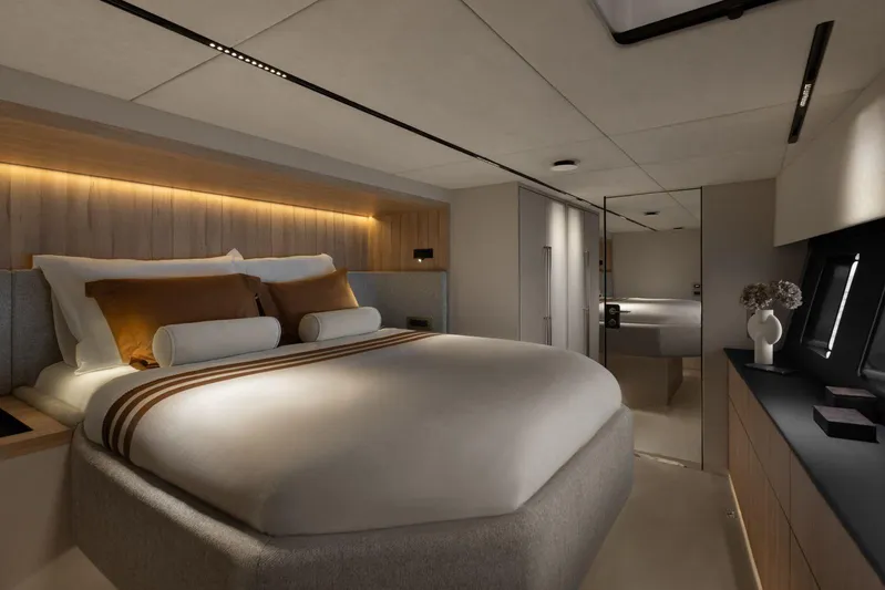  Yacht Photos Pics Luxurious bedroom interior of 2026 Moon Yachts 6ty, featuring modern design and ambient lighting.