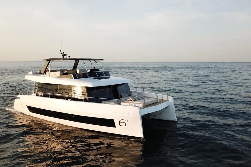  Yacht Photos Pics Luxury 2026 Moon Yachts 6ty cruising on open sea at sunset.