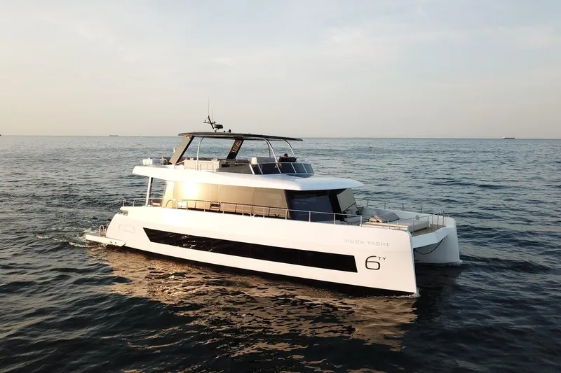  Yacht Photos Pics Luxury 2026 Moon Yachts 6ty cruising on open sea at sunset.