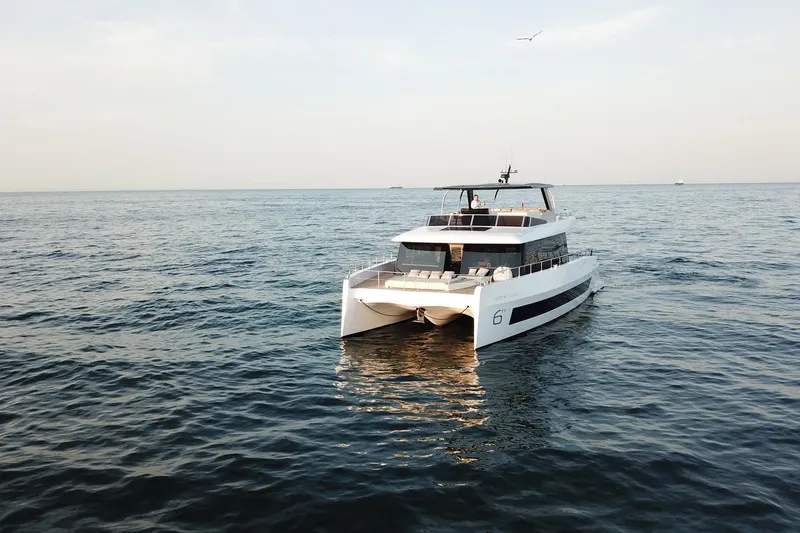  Yacht Photos Pics Luxury 2026 Moon Yachts 6ty catamaran sailing on open sea.