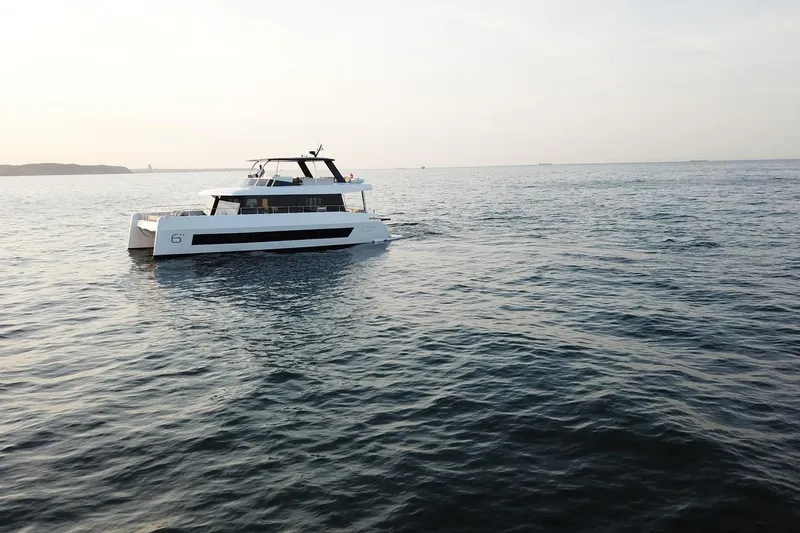  Yacht Photos Pics Luxury Moon Yachts 6ty 2026 model cruising on serene ocean waters.