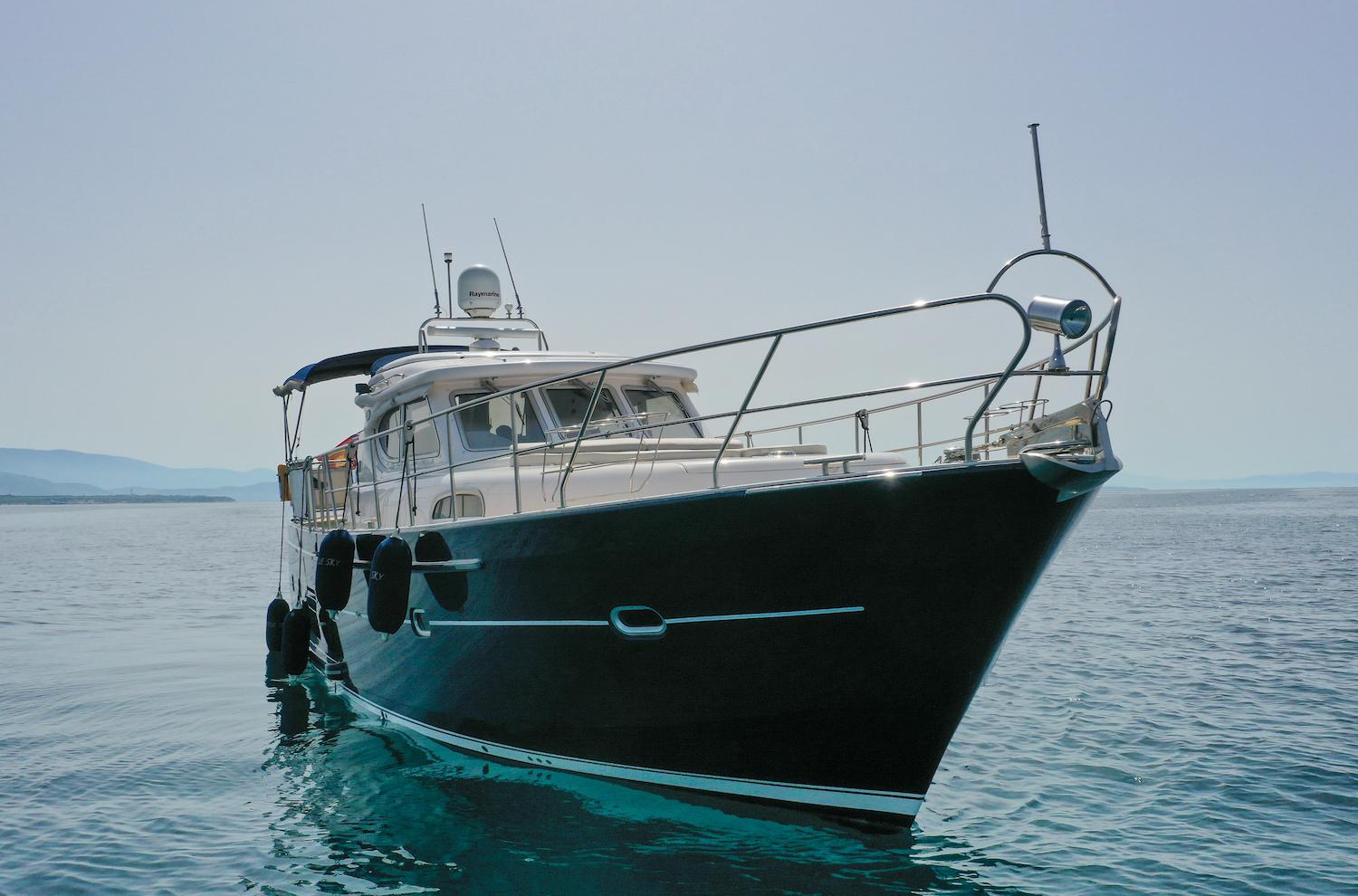 2014 Elling E4 Ultimate yacht on calm sea, showcasing sleek design and luxury features.