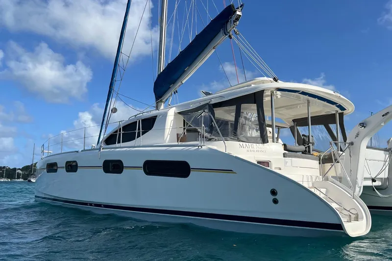 Mahi Mahi Yacht Photos Pics 2009 Leopard 46 catamaran sailing on blue ocean under clear sky.