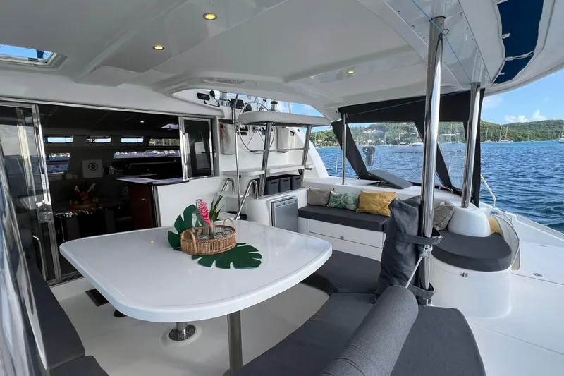 Mahi Mahi Yacht Photos Pics Luxurious 2009 Leopard 46 yacht interior with dining area and scenic ocean view.