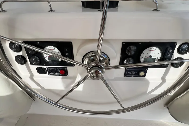 Mahi Mahi Yacht Photos Pics Steering wheel and dashboard of 2009 Leopard 46 yacht with gauges and controls.