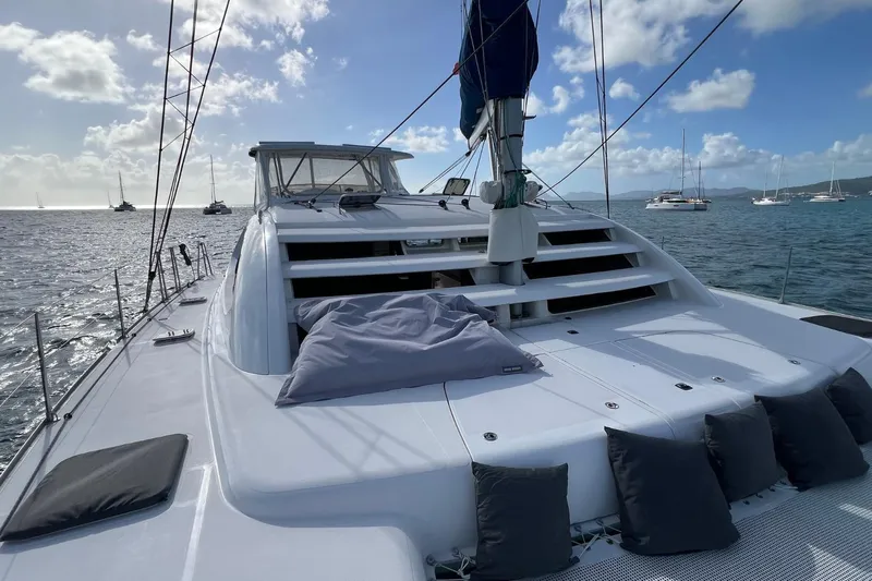 Mahi Mahi Yacht Photos Pics 2009 Leopard 46 yacht deck with cushions, sailing on a sunny day.