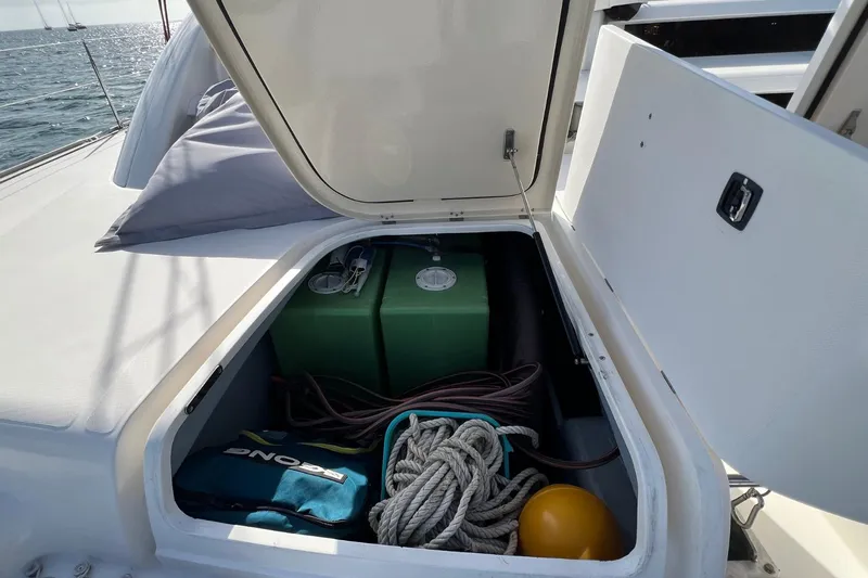 Mahi Mahi Yacht Photos Pics Storage compartment on a 2009 Leopard 46 yacht, containing ropes and equipment.