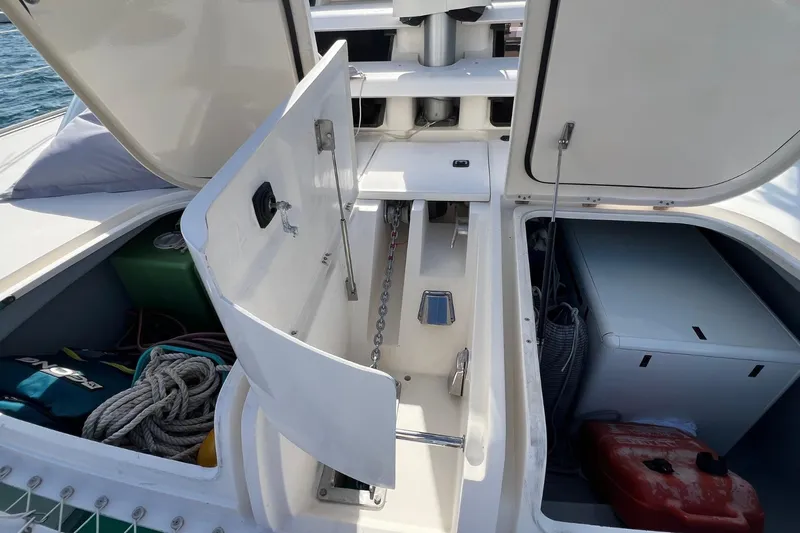 Mahi Mahi Yacht Photos Pics Open storage compartments on a 2009 Leopard 46 yacht, showing ropes and equipment.