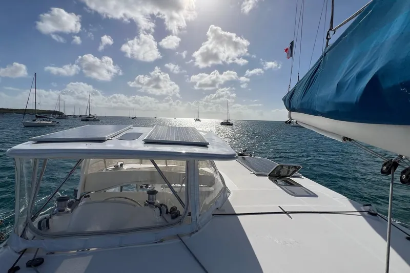 Mahi Mahi Yacht Photos Pics Sailing on a 2009 Leopard 46 catamaran with solar panels, under a sunny sky.