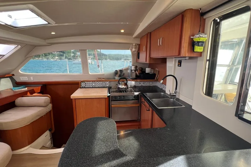 Mahi Mahi Yacht Photos Pics Luxurious kitchen interior of 2009 Leopard 46 yacht with modern amenities and scenic ocean view.