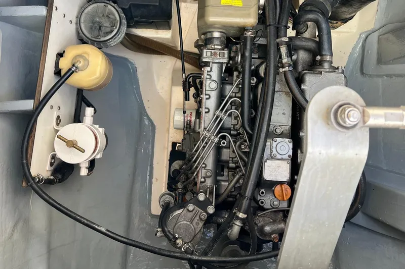 Mahi Mahi Yacht Photos Pics Engine compartment of a 2009 Leopard 46 yacht, showcasing mechanical components and hoses.