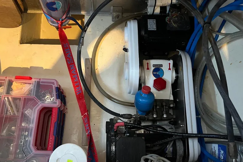 Mahi Mahi Yacht Photos Pics Engine compartment of a 2009 Leopard 46 with tools and mechanical components.