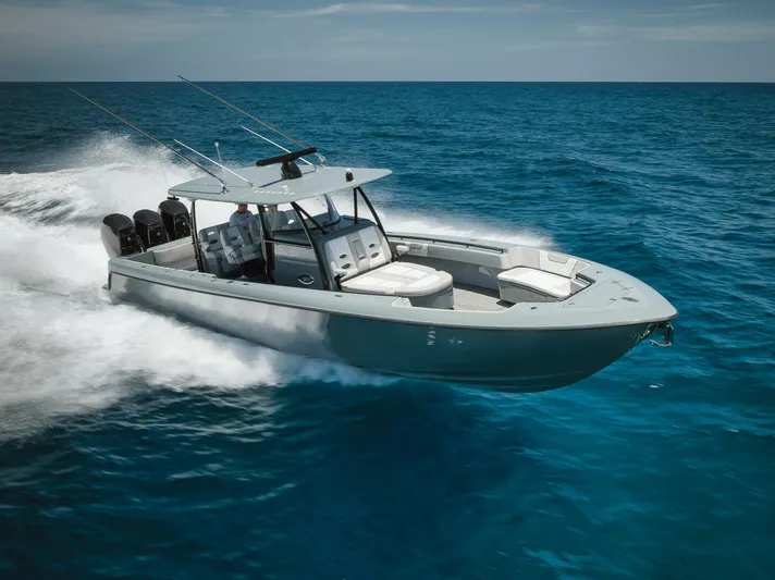 Deal Maker Yacht Photos Pics 2024 Contender 44ST boat cruising on open ocean.