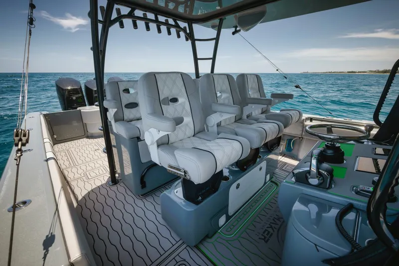 Deal Maker Yacht Photos Pics 2024 Contender 44ST boat interior with luxurious seating and ocean view.