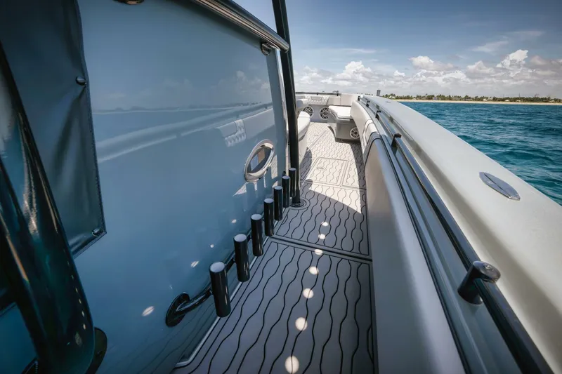 Deal Maker Yacht Photos Pics 2024 Contender 44ST boat deck with rod holders and ocean view.