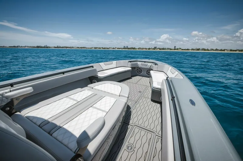 Deal Maker Yacht Photos Pics 2024 Contender 44ST boat interior with luxurious seating on open water.