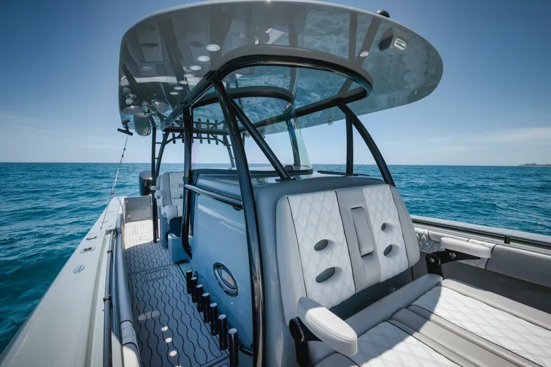 Deal Maker Yacht Photos Pics 2024 Contender 44ST boat interior with seating and ocean view.