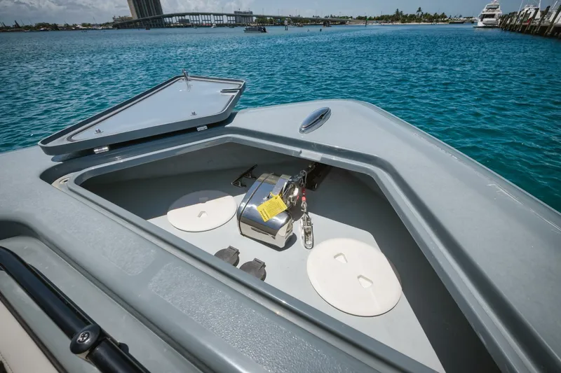 Deal Maker Yacht Photos Pics 2024 Contender 44ST boat anchor storage compartment with open hatch.