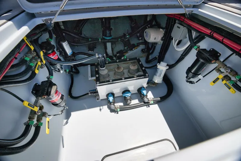 Deal Maker Yacht Photos Pics 2024 Contender 44ST engine compartment with fuel filters and wiring.