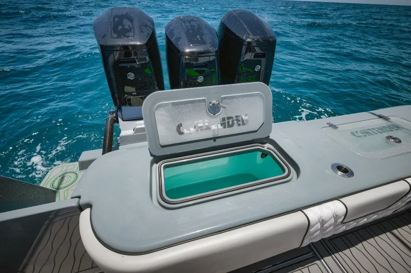 Deal Maker Yacht Photos Pics 2024 Contender 44ST boat with triple outboard engines on the open sea.