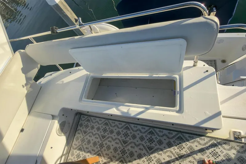 Daybreak Yacht Photos Pics 2002 Bayliner 3988 Command Bridge Motoryacht open storage compartment on deck.