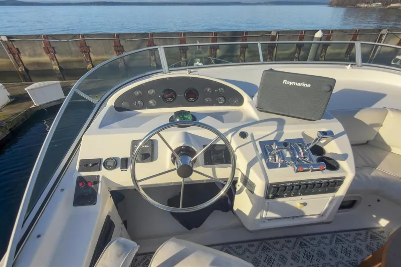 Daybreak Yacht Photos Pics 2002 Bayliner 3988 Command Bridge Motoryacht helm with Raymarine navigation system.
