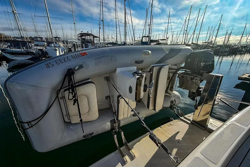 Daybreak Yacht Photos Pics 2002 Bayliner 3988 Command Bridge Motoryacht with dinghy and Tohatsu outboard motor.