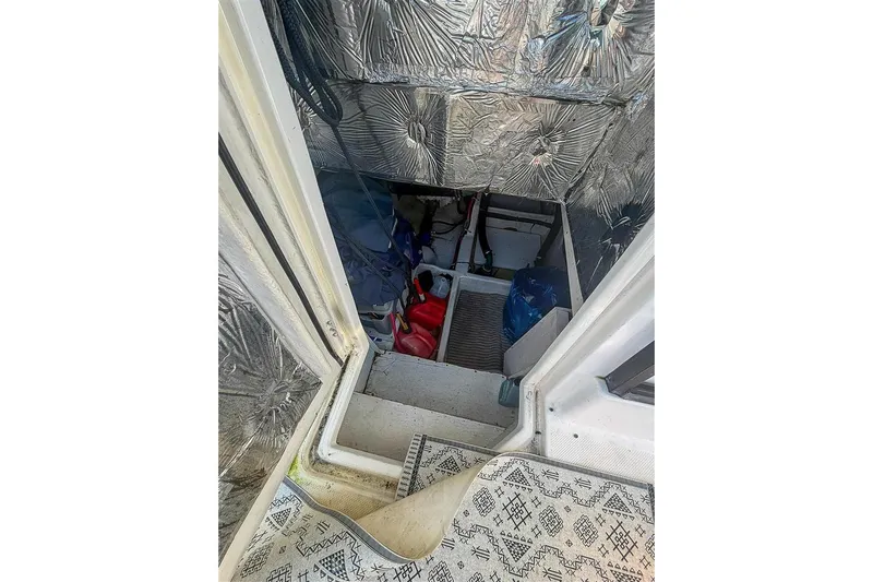 Daybreak Yacht Photos Pics Engine room access on 2002 Bayliner 3988 Command Bridge Motoryacht, featuring insulation and storage.