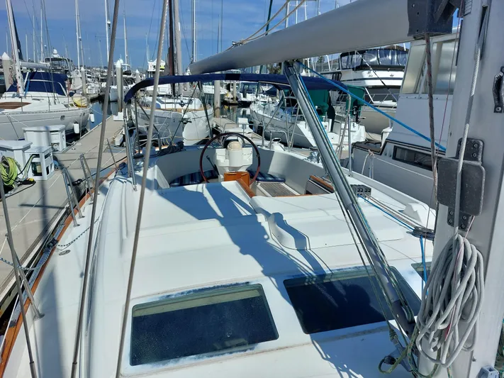 Wind & Wine Yacht Photos Pics Beneteau Oceanis 42CC sailboat, 2002 model, docked in a marina.