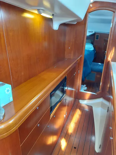 Wind & Wine Yacht Photos Pics Interior of 2002 Beneteau Oceanis 42CC yacht with polished wood finish.