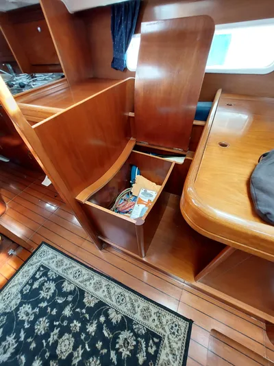 Wind & Wine Yacht Photos Pics Interior of 2002 Beneteau Oceanis 42CC sailboat with wooden cabinetry and storage.