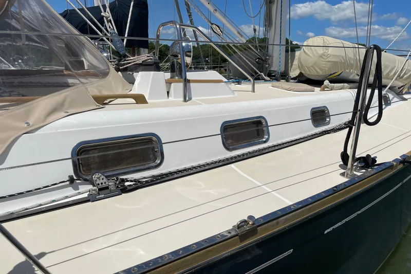 Maeve Yacht Photos Pics Tartan 3700 sailboat from 2004, featuring sleek deck design and modern fittings.