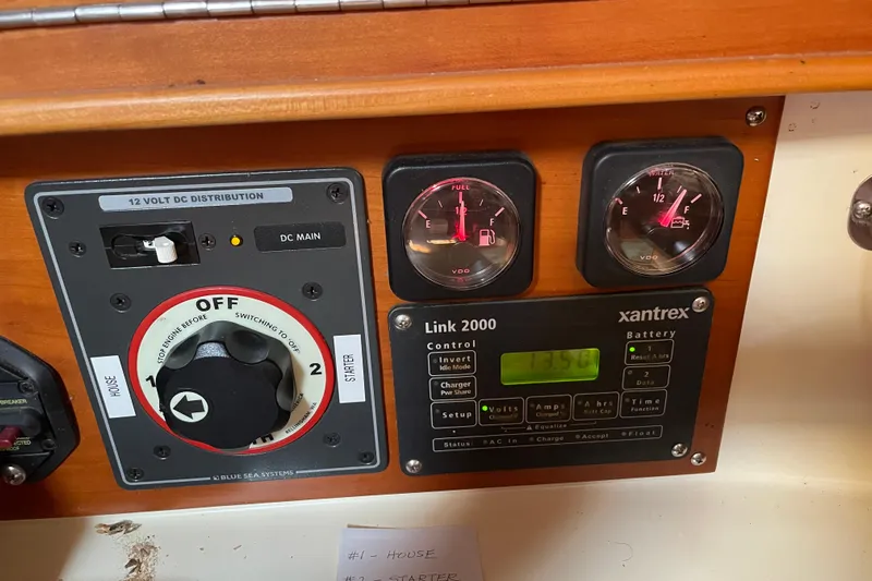 Maeve Yacht Photos Pics Control panel of a 2004 Tartan 3700 sailboat with gauges and switches.