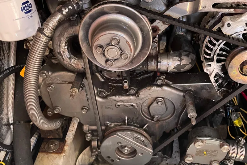 Maeve Yacht Photos Pics Engine components of a 2004 Tartan 3700, featuring belts and hoses in close-up view.