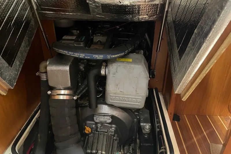 Maeve Yacht Photos Pics Engine compartment of a 2004 Tartan 3700 sailboat, featuring a Yanmar engine.