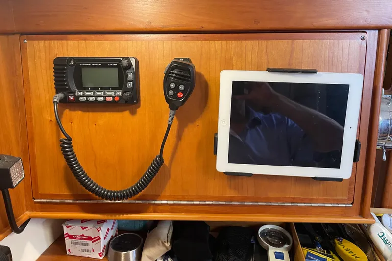 Maeve Yacht Photos Pics Boat interior with mounted radio and tablet on wooden panel, Tartan 3700, 2004 model.