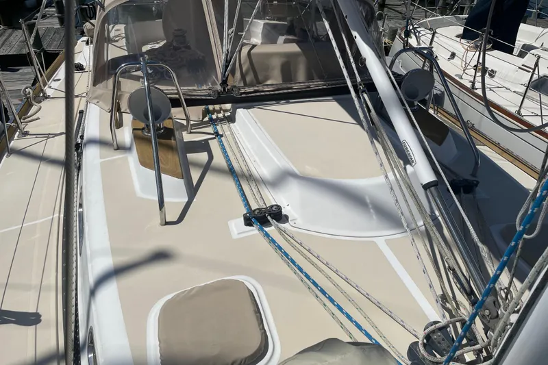 Maeve Yacht Photos Pics 2004 Tartan 3700 sailboat deck with rigging and winches in marina setting.